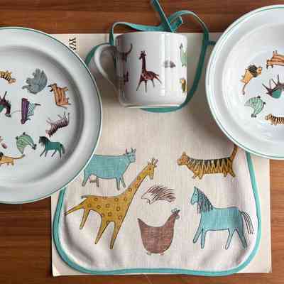 Bib with Arabia Finland “Zoo” child’s breakfast set.
