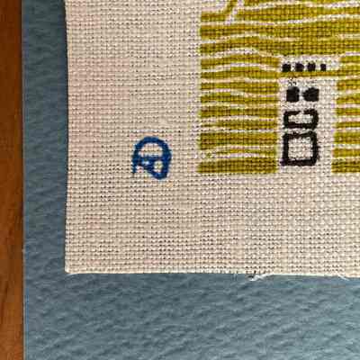 Initials AD or DA of unidentified freelance artist working in the style of Robert Darr Wert, lower left corner of linen print.