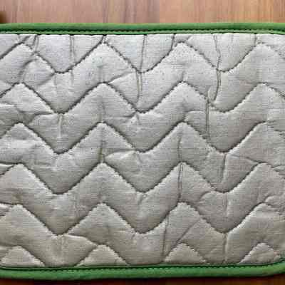 Potholder back with heat resistant coating.
