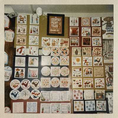 Country Print Tiles Sign, top center.