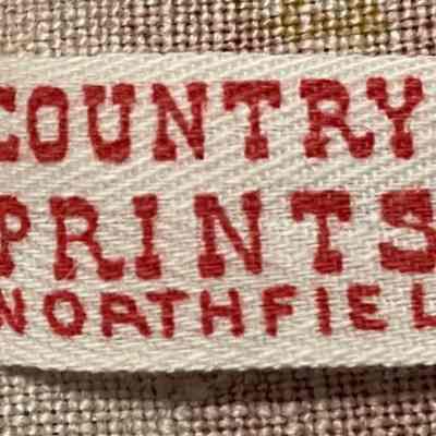 Example of the Country Prints Northfield product tag in red ink.: Northfield Historical Society collection.