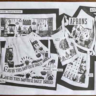 Matching apron: Daily Bread 426, left center.: From “Mat Sets by Robert Darr Wert/Country Prints”, c.1960.