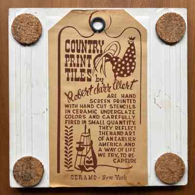 Tile back with cork pads and Country Prints label hanger.