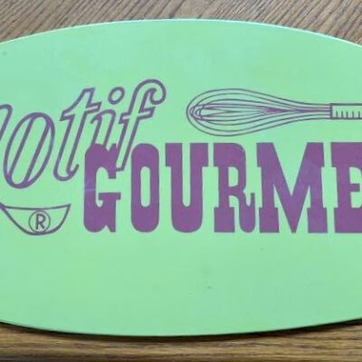 Motif Gourmet sign (silkscreen print), 9 3/4” x 21 1/2”.
