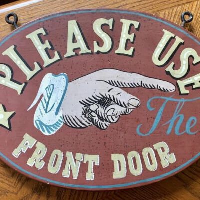 Directional sign (hand painted), approximately 9” x 12”.