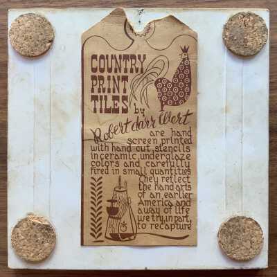 Tile back with Country Print Tiles label hanger and cork pads.