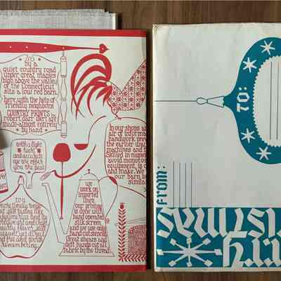 Red pack board with folded wall hanging and Christmas shipping envelope.: PKM collection.