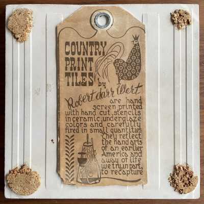 Tile back with Country Print Tiles label hanger and cork pads.