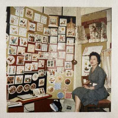 Small Country Prints Towel Rack in use, upper right corner.: c.1960-1965 Country Prints trade show booth. Image: Collection of Sara Leeper.