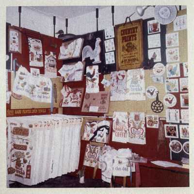 Large Country Prints towel rack, lower left corner.: c.1960-1965 Country Prints trade show booth. Image: Collection of Sara Leeper.