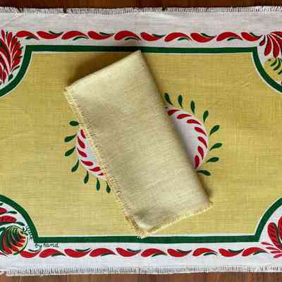 Tole 121 (TK) placemat in yellow with possible matching solid yellow napkin.: Collection of Sara Leeper. Images: PKM