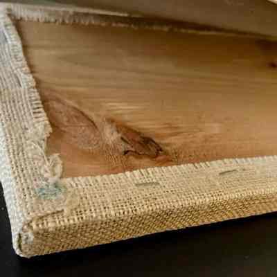 Construction detail with chipboard backing panel lifted away, back of wall board.