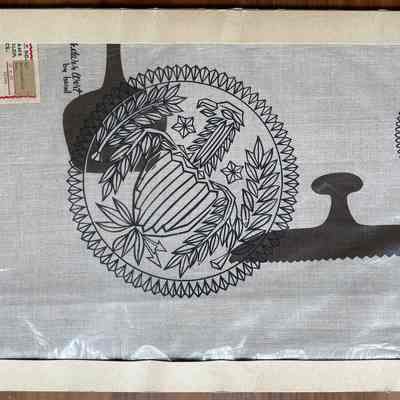 Tablecloth in original die cut table linen packaging.