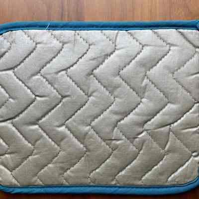 Potholder back with heat resistant coating.