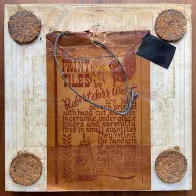 Tile back with partial Country Print Tiles label hanger and cork pads.
