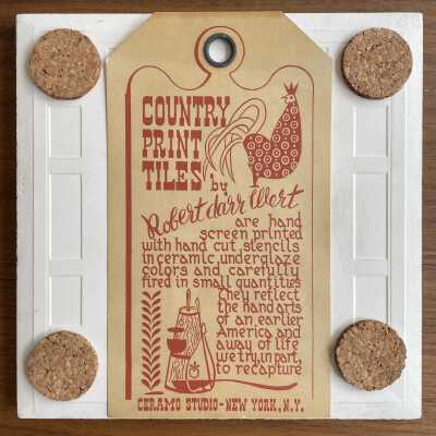 Tile back with Country Print Tiles label hanger and cork pads.