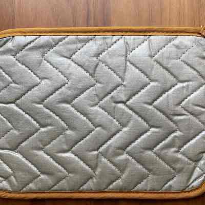Potholder back with heat resistant coating.