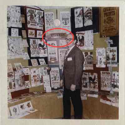Robert Darr Wert in a Country Prints trade show booth with the Kitchen Pockets sign, c.1964.: Image: Collection of Sara Leeper.