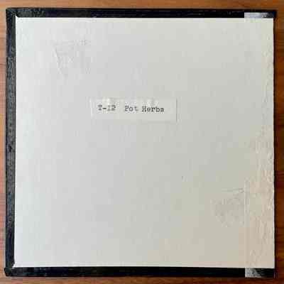 Tile sample back with product number and name.