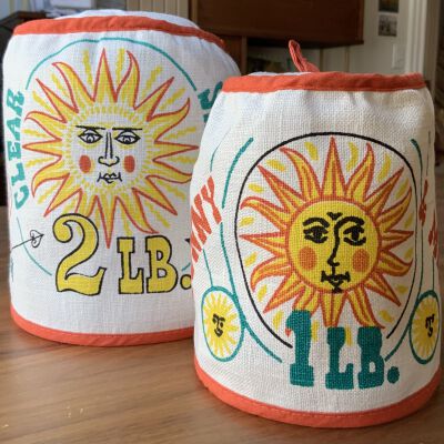 1 lb. and 2 lb. coffee can covers: Motif Gourmet, Good Day, Orange.: PKM collection.