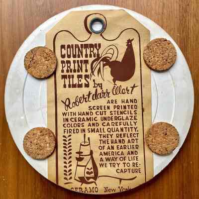 Tile back with Country Prints Tiles label hanger and cork pads.
