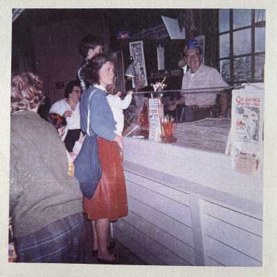 Robert Darr Wert, right, demonstrating at the Eastern States Exhibition, 1960’s. God Gives Milk wallhanging at right.: Image: Collection of Sara Leeper.