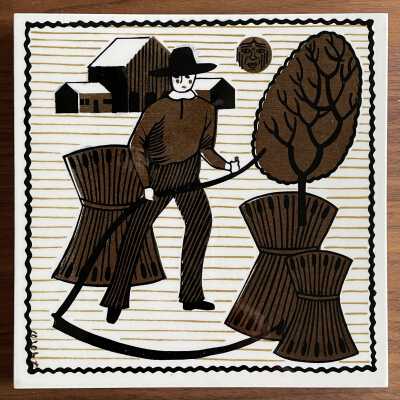 Matching tile: Almanac (TK).: Farmer with scythe, barns and sun/moon face are similar to those seen in the topmost section of the Almanac wallhanging. PKM collection.