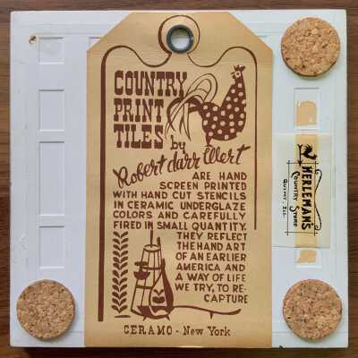Tile back with Country Print Tiles label hanger, cork pads and retailer label.