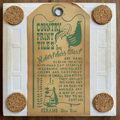 Tile back with Country Print Tiles label hanger in green.
