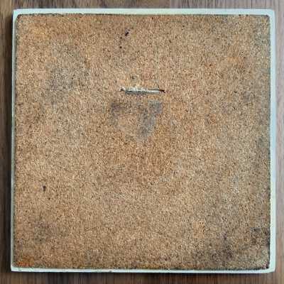 Tile back with cork backing.