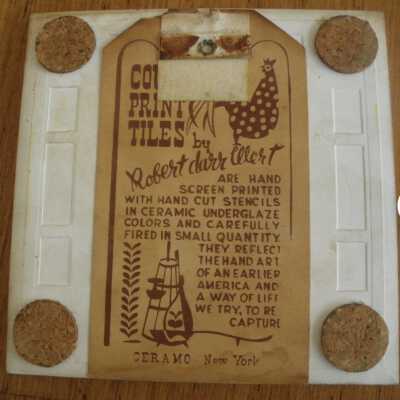 Tile back with Country Print Tiles label hanger and cork pads.