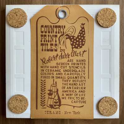 Tile back with Country Print Tiles label hanger and cork pads.