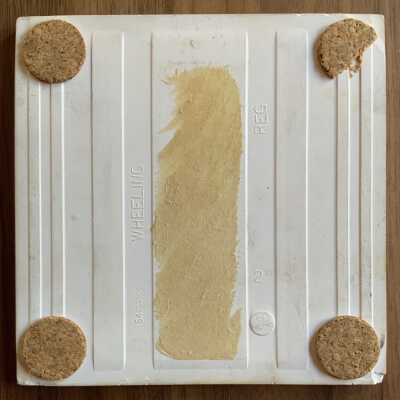 Back of tile with Country Print Tiles with cork pads and label hanger removed.