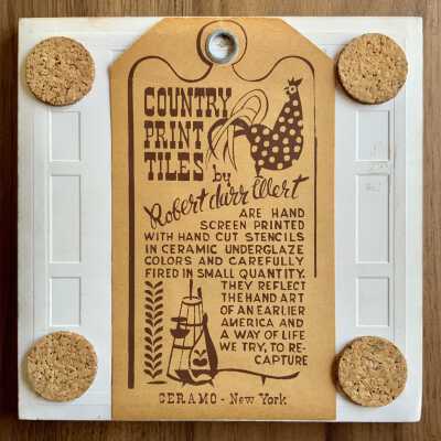 Tile back with Country Print Tiles label hanger and cork pads.