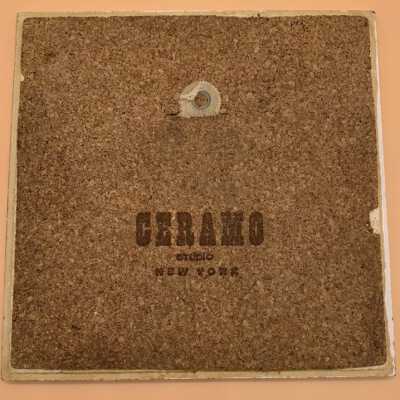 Back of tile with Ceramo Studio branding.