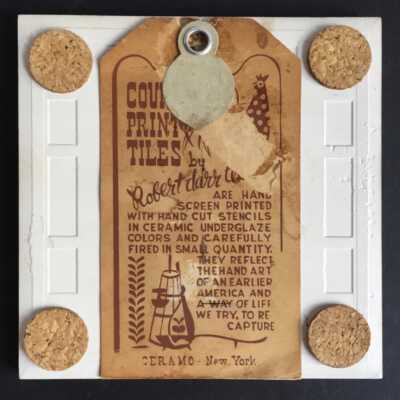 Tile back with Country Print Tiles label hanger and cork pads.