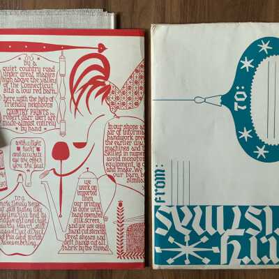 Complete lot with folded contents of shipping envelope.: L-R: Folded wall hanging, product tag, folded backing board, and shipping envelope. See separate entry for “Christmas Story No. 260”.