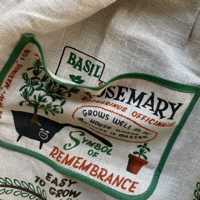 Inside the pocket is a depiction of a tabbed “recipe card” describing the herb basil.