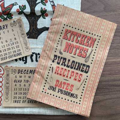 Paper calendar and folded paper cookbook.