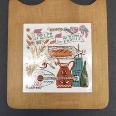 Peace and Plenty T-19 tile inset in a breadboard; see “Breadboards”.: Image: LittleRedHenVintage, Etsy.com
