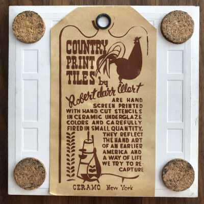 Tile back with Country Print Tiles label hanger and cork pads.