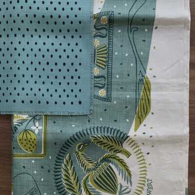 Some Buttermolds tablecloth with coordinating blue napkins.: PKM collection.