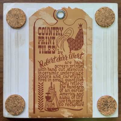 Tile back with County Print Tiles label hanger and cork pads.