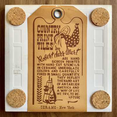 Tile back with Country Print Tiles label hanger and cork pads.