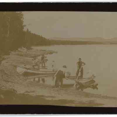 Young men with rowboats
