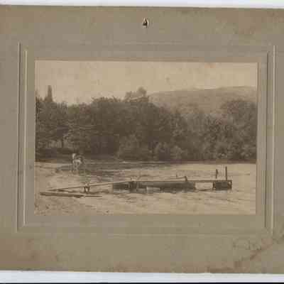 Driving a horse carriage through the water