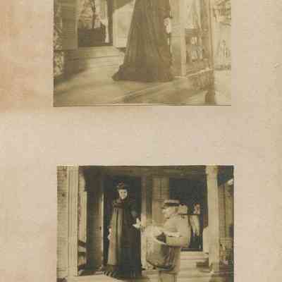 Woman in dark-colored dress on porch; Postman helping woman down steps