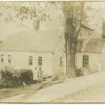 Children in front of house