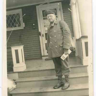 Camden postman on steps of Green Gables Inn