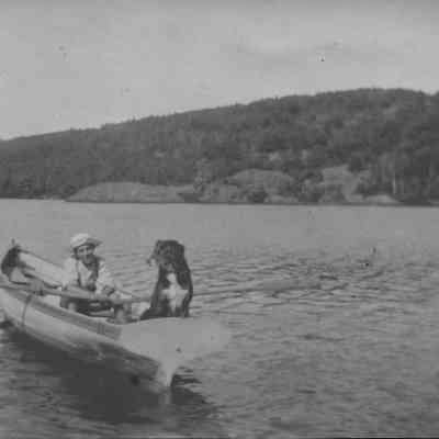 Boy rowing on Hosmer Pond